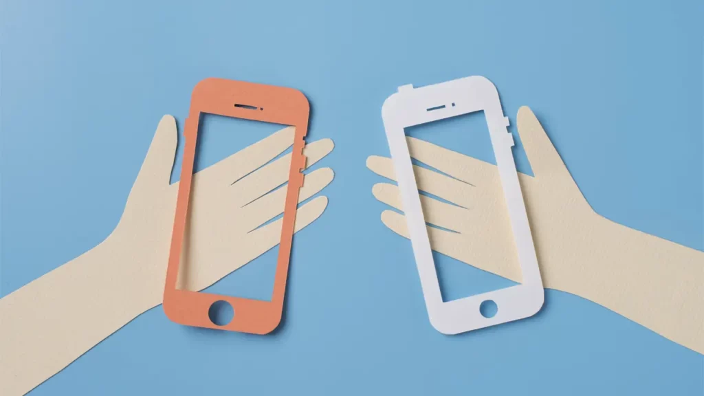 Two people holding mobile phones.