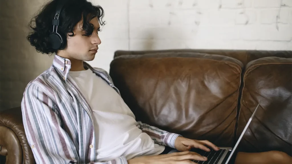 A person using TTS API on their laptop.