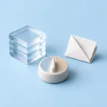 WAV vs MP3 for Voiceovers: Which Should You Export? — a layered glass sound block, folded paper token, and decision dial represent export choices.